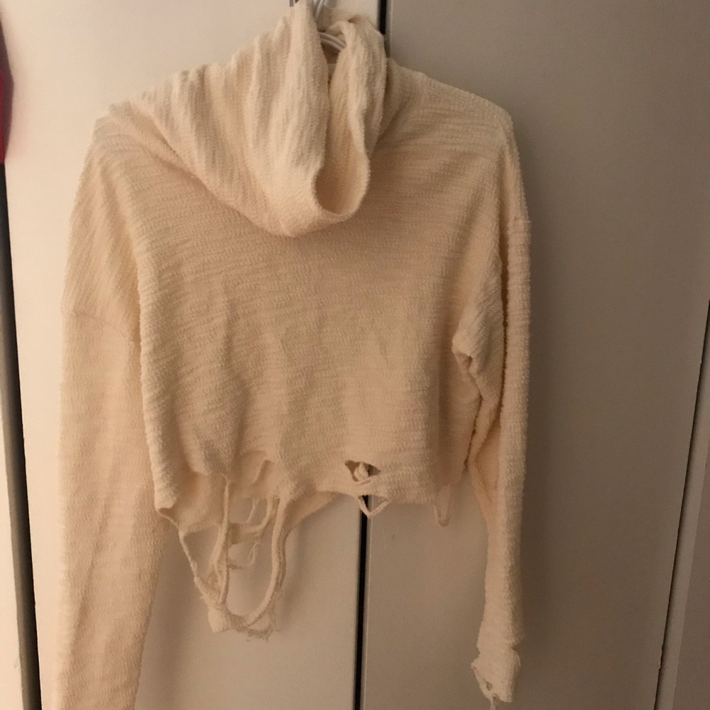 Distressed cream sweater